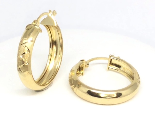 Yellow gold hoop earrings with patterns