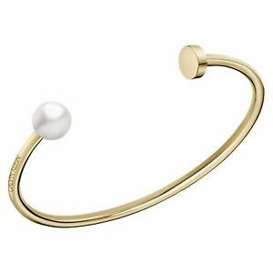 Rigid golden steel and pearl bracelet