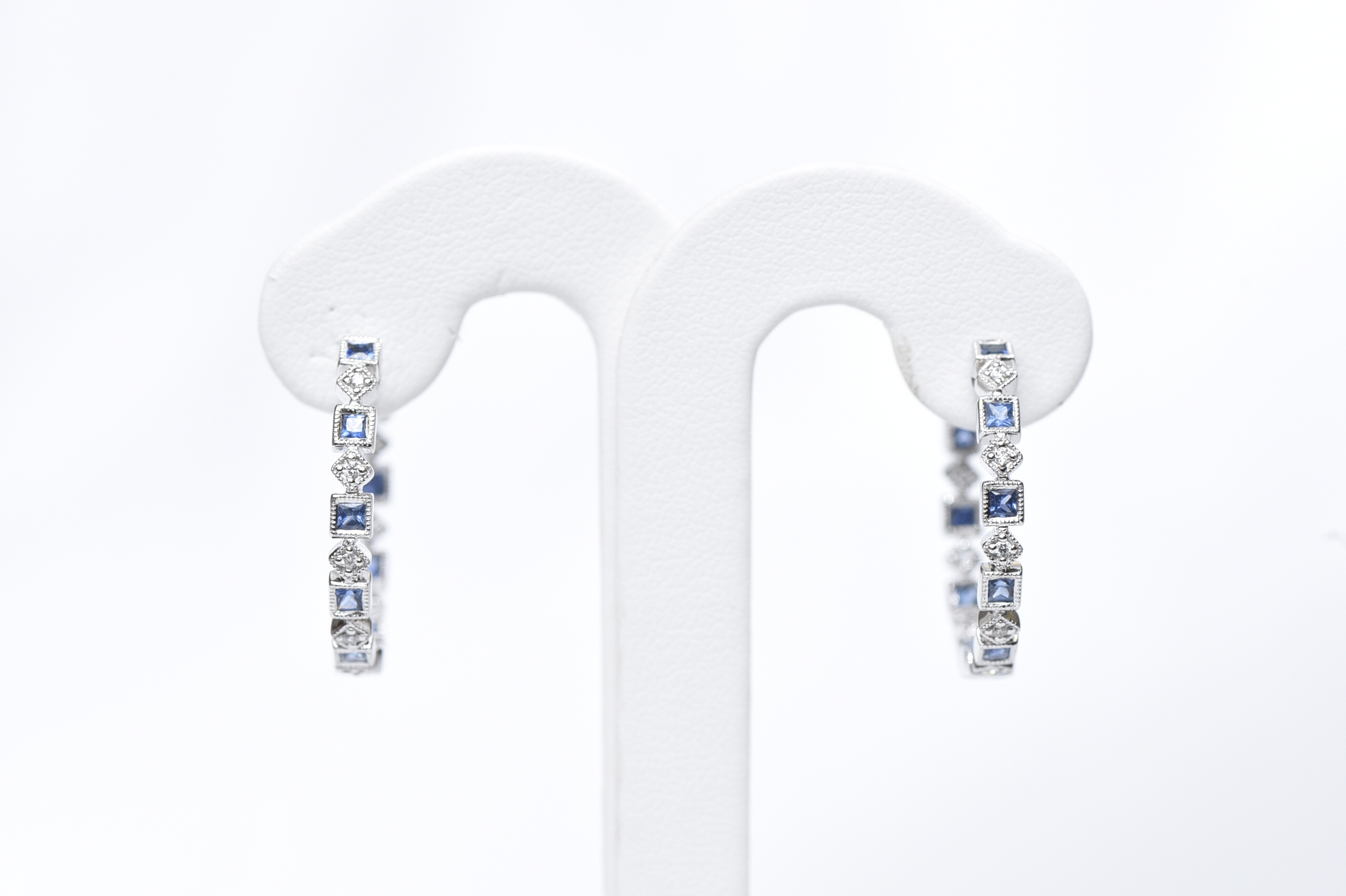 White gold hoop earrings 25 dia pts and sapphire